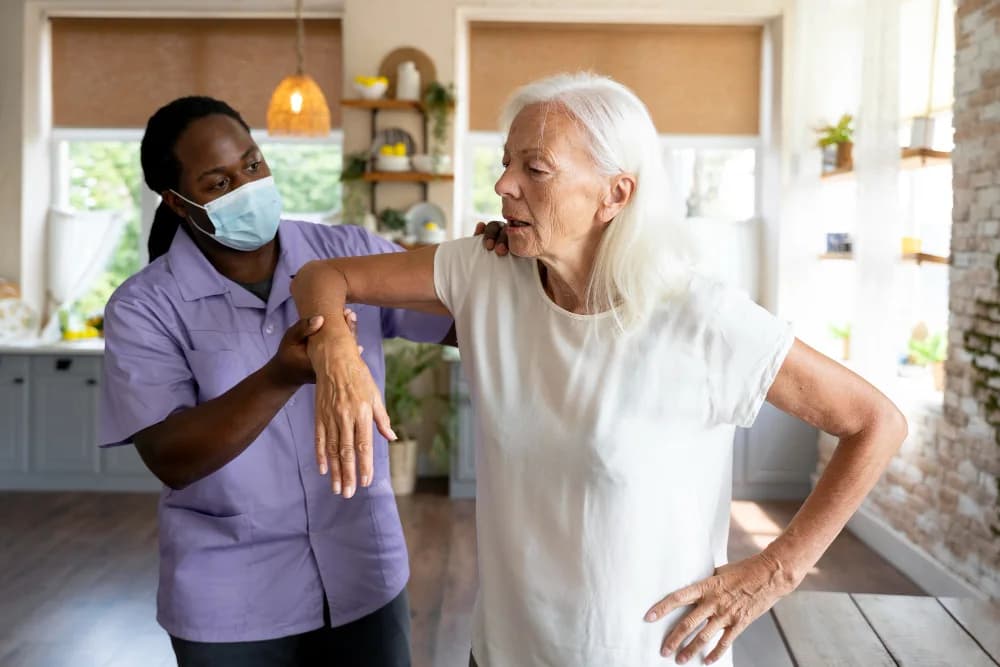 An occupational therapist guiding a client through an exercise